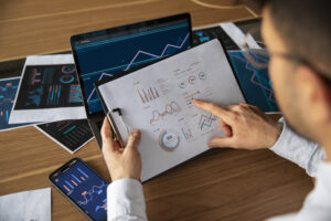 office workers using finance graphs